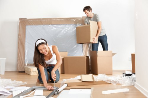 House removalists loading furniture for a local move in Debeauvoirtown