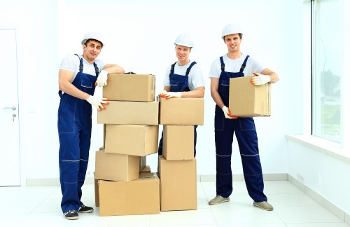 Packed office furniture and labeled boxes ready for an office move