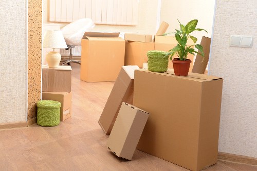 Local moving team transporting office items with a removals van in Debeauvoirtown