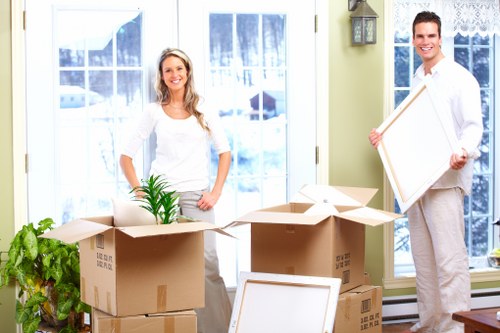 Local van removal team handling furniture and boxes in Debeauvoirtown