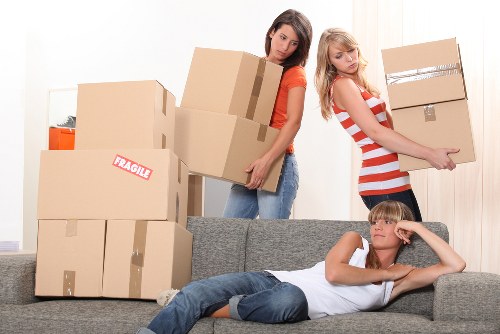 Careful loading of fragile items into a moving van