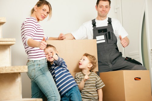Furniture being carried carefully from a Debeauvoirtown property